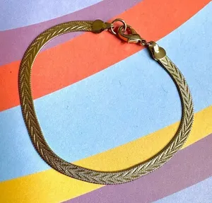 Gold tone flat herringbone bracelet thumbnail 1