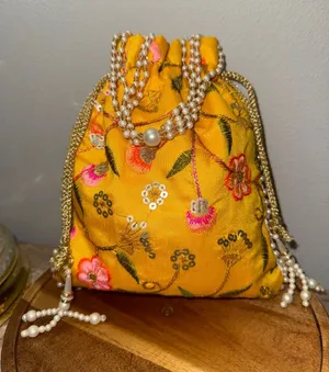 Yellow Floral Embroidered Indian potli Bag thumbnail 1