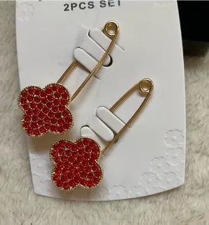 Appleseed's Gold Safety Pin Earrings with Red Clover Charms thumbnail 1