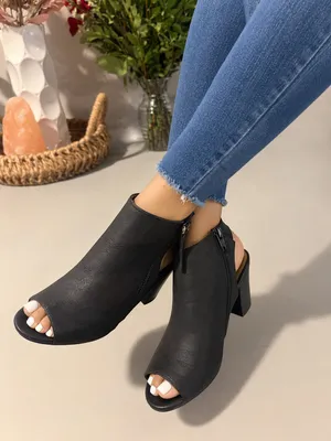 Celia Stylish black heeled booties with a modern and elegant design 👠 Perfect to elevate any outfit, whether casual or dressy. Featuring a comfortable block heel and side zipper for easy wear, these booties are both chic and practical. 💫 Sleek and versatile black design 👠 Comfortable block heel 🔒 Easy side zipper ✨ Perfect for day or night looks 📏 Size: Women’s 8 💖 Worn only once — in great condition ⚠️ Small minor scuff (shown in photos), barely noticeable thumbnail 1