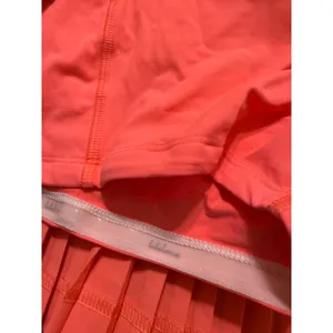 Lululemon Pleated Tennis Skort Coral Neon Orange Athletic Skirt Zipper Pocket‎ thumbnail 6