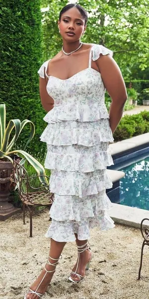 Eloquii bridal dress features a corseted bodice and tiered ruffled skirt. thumbnail 1