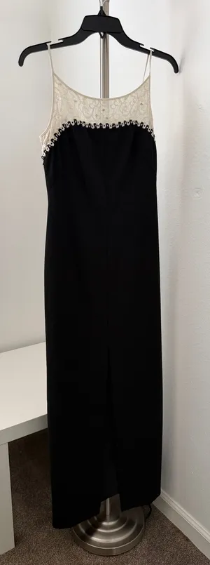 Elegant black maxi dress featuring a delicate cream lace yoke and thin straps. thumbnail 1