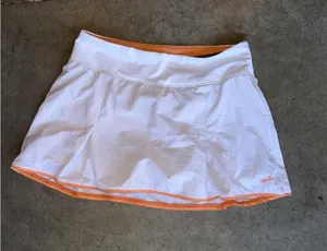 white and orange Brooks Chaser Skort thumbnail 1