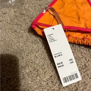 Out from under orange and pink off shore triangle bikini top never worn M/L thumbnail 5