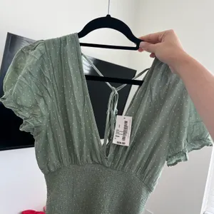 South Moon Under - A Love Like You- Green V neck white polka dot dress thumbnail 3