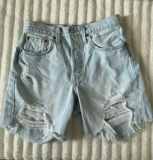 Levi's 501 Light Blue Distressed High-Rise Denim Shorts thumbnail 1