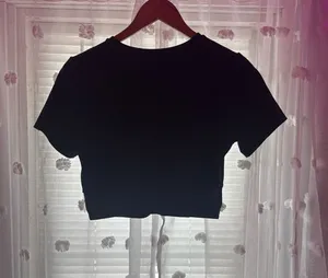 JoyLab cropped black athletic top with crisscross on the bottom of back thumbnail 1