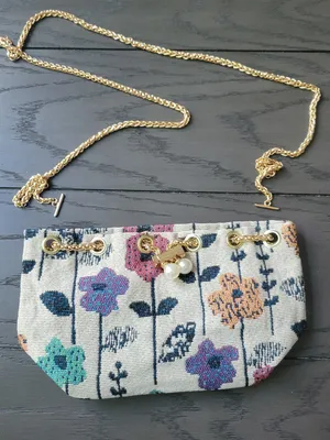 Floral embroidered mini bucket crossbody bag with a gold chain strap Purse thumbnail 1