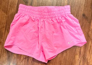 pink Nike One Dri-FIT running shorts with an elastic waistband and brief lining thumbnail 2