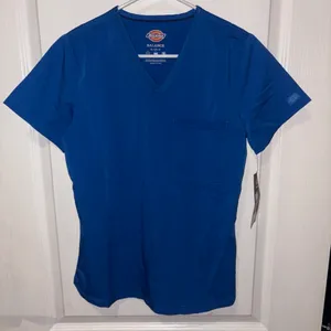 blue Dickies Balance scrub top features a v-neckline and a functional chest pocket. thumbnail 1