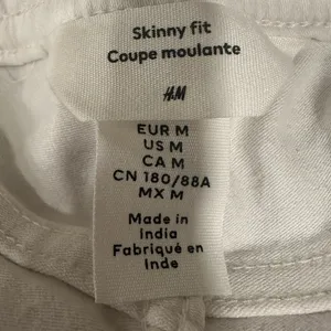 EUC H&M white distressed waist string skinny jeans thumbnail 5
