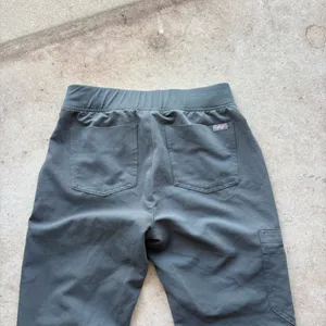 FIGS Zamora Jogger Scrub Pants in the limited-edition bonsai green colorway, featuring a comfortable yoga waistband and contrasting reddish drawstring thumbnail 5