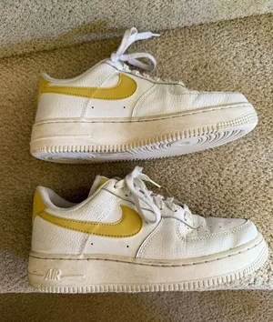 Nike White Low-Top Sneakers with Yellow Swoosh thumbnail 1