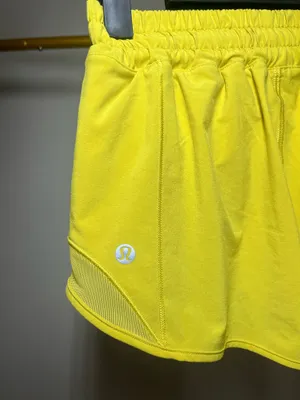 Lululemon yellow shorts with white reflective stripes #activewear #athletic thumbnail 3