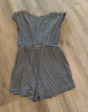 Urban Outfitters Striped Romper - Excellent Condition - Women’s Size M Description: Upgrade your casual wardrobe with this effortless Urban Outfitters striped knit romper! Made in the USA, this stylish piece features a classic navy and white nautical stripe pattern with a flattering deep V-neckline, soft cap sleeves, and a comfortable cinched elastic waistband. Crafted from a soft, lightweight stretch fabric, it’s perfect for summer outings, beach cover-ups, or casual weekend wear. Brand: Urban Outfitters Size: Women’s Medium (M) Condition: Excellent, like-new condition with no visible flaws, stains, or excessive wear. Details: Elasticized waist, short inseam, breathable stretch material, made in USA. Fast shipping from a smoke-free home! Feel free to drop a comment with any questions or send reasonable offers. thumbnail 1