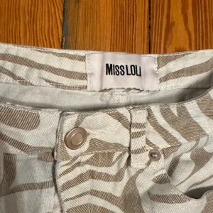 Miss Lola Tan and White Patterned Pants thumbnail 2