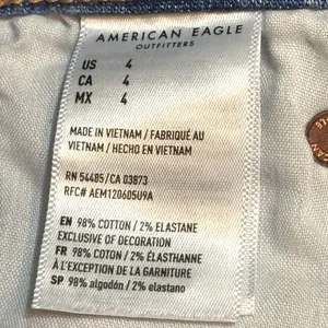 American Eagle Distressed Denim Mini Skirt Raw Hem Light Wash Size 4 thumbnail 6