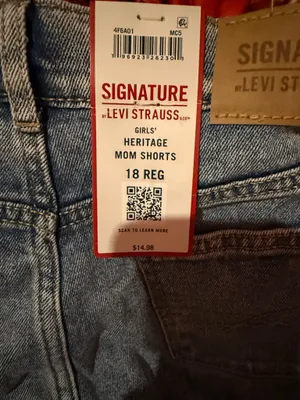 Signature Levi Strauss light blue denim shorts with delicate floral embroidery. Comfortable high-rise fit designed for everyday wear. Soft, faded blue wash that pairs easily with casual tops. Floral detailing adds a feminine touch. thumbnail 8