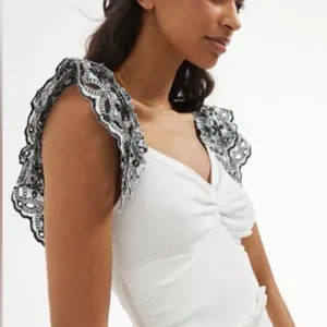 Anthropologie white ruffled top thumbnail 1