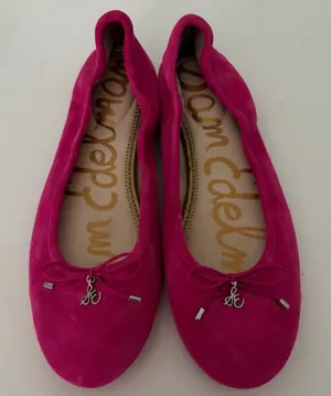 Vibrant pink suede, leather ballet flats by Sam Edelman. Featuring a rounded toe with silver logo charm detail. Perfect for adding flair to any outfit. thumbnail 1