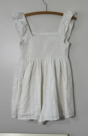 American Eagle cream romper with a tassel tie thumbnail 1