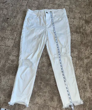 American Eagle White Distressed High-Waisted Jeans with Frayed Hem size 14 thumbnail 1