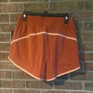 Stylish Women's Athletic Shorts in Rust by Nike thumbnail 2