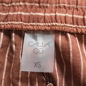 Calia Women's High-Rise Dolphin Shorts in Yucatan Stripe Cinnamon Size XS NWT thumbnail 5