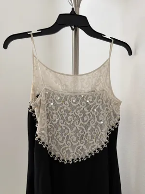 Elegant black maxi dress featuring a delicate cream lace yoke and thin straps. thumbnail 3
