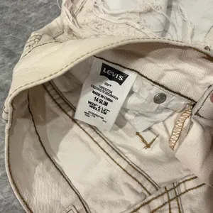 Levi's Women's Frayed Cream Jean Shorts thumbnail 3
