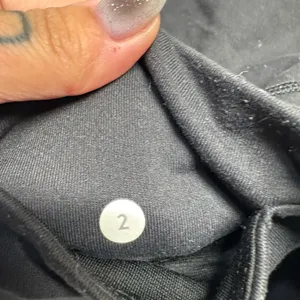 Lululemon Black Leggings with Sheer side panels with Criss Cross details- size 2 thumbnail 3
