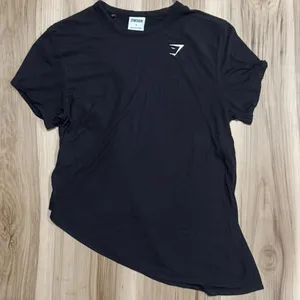Gymshark Asymmetrical Short Sleeve Athletic Shirt Women’s Small thumbnail 1