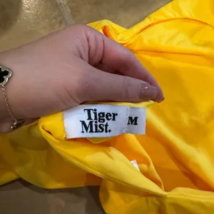 Yellow body suit. Tiger mist thumbnail 3