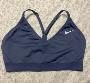 Nike Dri-FIT Indy Women's Light-Support Padded V-Neck Sports Bra in a blue/purple color thumbnail 1