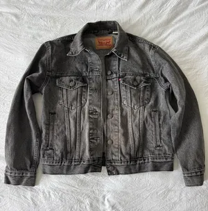 Levi's Faded Black Denim Trucker Jacket thumbnail 1