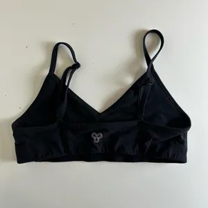 Aritzia Tna Butter Set this set comes with cheeky biker shorts, hold tight bra, and butter bound t-shirt all in black set retails for $136 thumbnail 4