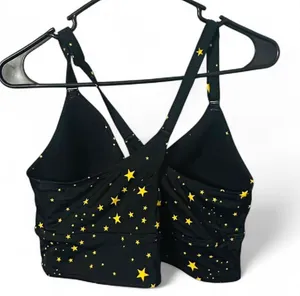 Torrid Black and yellow star print bikini top with adjustable straps and removable padding. Straps can be removed if you prefer to not have a racer back. Size 12 D/DD. Excellent condition. All offers accepted. Shipping next day. thumbnail 2