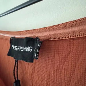 PrettyLittleThing Ruse Brown Bow Tie Front Wide Leg Jumpsuit‎ Strapless thumbnail 6