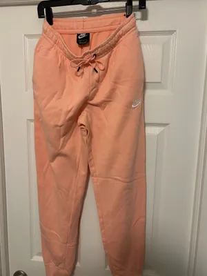 NIKE size small Soft fleece joggers in a warm peach-coral shade. Elastic waistband with adjustable drawstring. Tapered legs with cuffed ankles. Embroidered Nike logo at hip. Cozy everyday women small brand new thumbnail 6