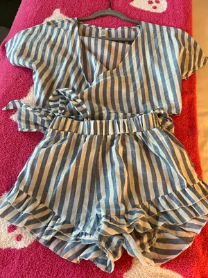 Amazon Stylish blue and white striped romper with ruffle details. Perfect for casual outings. thumbnail 2