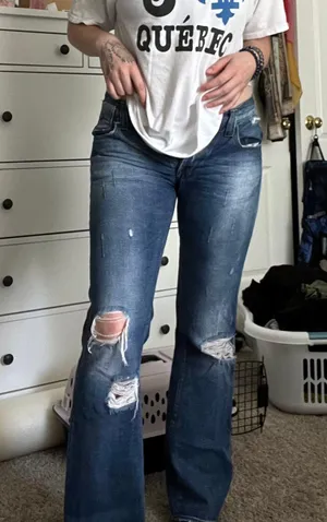 distressed bootcut jeans thumbnail 1