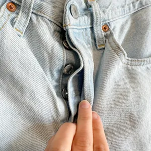 Levi's | 501 Original 100%‎ Cotton Cut Off Raw Hem Jean Shorts in Medium Blue thumbnail 4