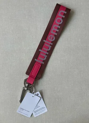 Lululemon Never Lost Keychain Wordmark - Ancient Copper/Glaze Pink thumbnail 1