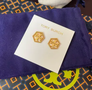 Tory Burch MILGRAIN LOGO HEX Gold tone PLATED STUD EARRINGS NWT in dust bag thumbnail 1