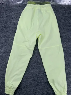 Nike Women's Sportswear Woven Pants in a bright neon green/yellow XS thumbnail 8
