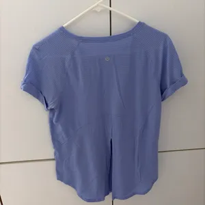 Blue Lululemon swiftly tech shirt with subtle horizontal ribbed texture #athletic #activewear thumbnail 2