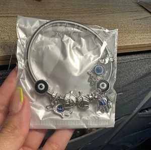 Silver bracelet with evil eye charms. thumbnail 3