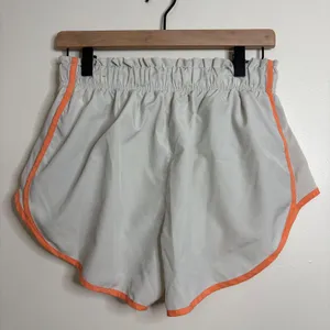 Nike Dri‎ Fit Running Shorts Women Light Gray Orange Trim Athletic Gym Size L thumbnail 4