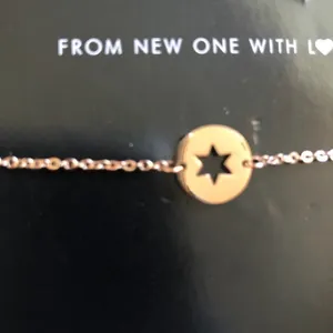 Gold tone star bracelet thumbnail 2